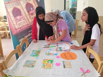 ساخت روزنامه دیواری جشنواره کتابخوانی رضوی در کتابخانه روستایی اشتهارد