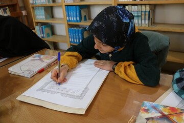کتابت کلام وحی در کتابخانه مرکزی کرمان