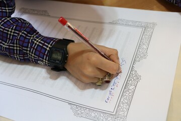 کتابت کلام وحی در کتابخانه مرکزی کرمان