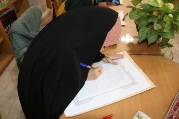کتابت کلام وحی در کتابخانه مرکزی کرمان