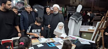 میز خدمت و برنامه‌های فرهنگی کتابخانه‌های عمومی پلدختر در تجمعات شبانه مردمی محرم