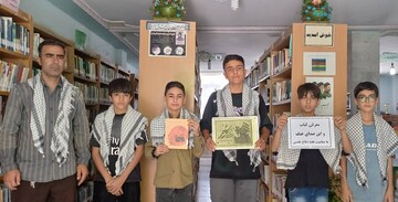 ترویج فرهنگ کتاب وگرامیداشت هفته دفاع مقدس در کتابخانه امامزاده محمد درب‌گنبد